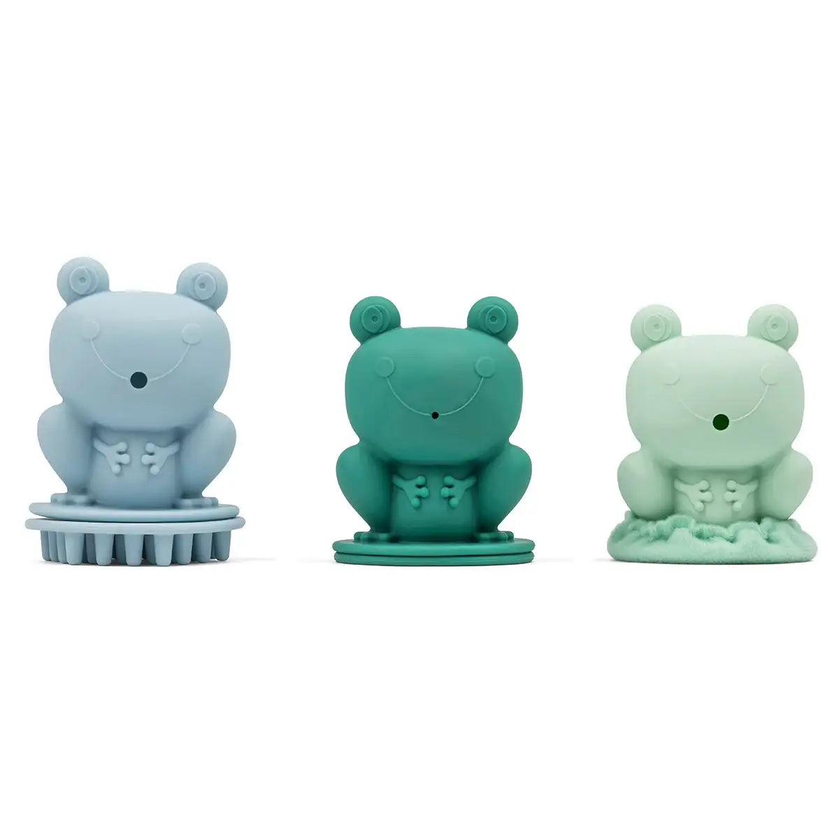 Drei farbige Frosch-Spielzeuge in Blau, Grün und Mint mit Bürsten- und Texturdetails